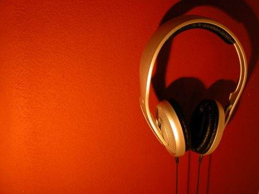 west coast swing music, Red Background with Gold over ear headphones